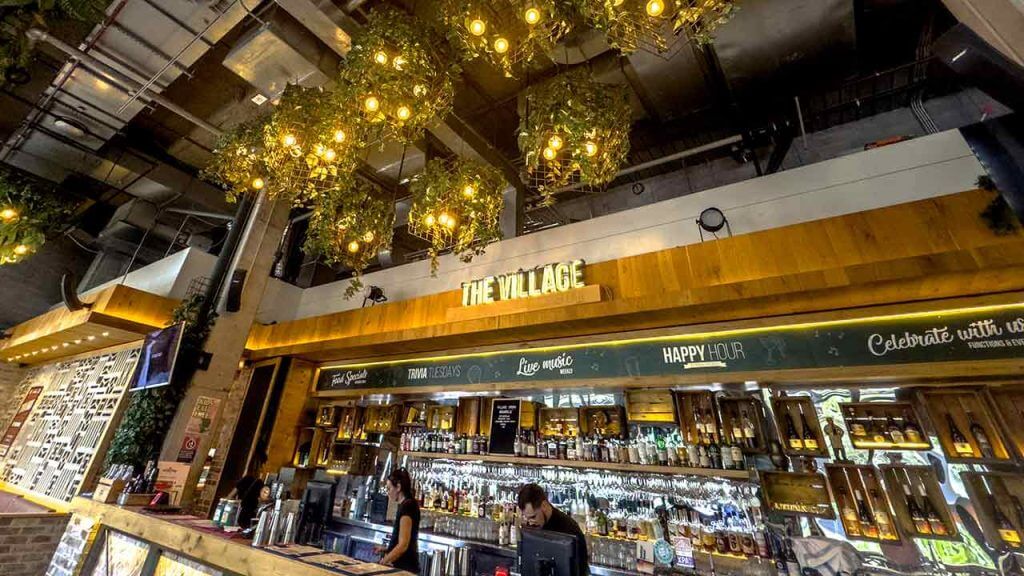 Village Crown's Cozy Venue with Bartenders and Craft Beers